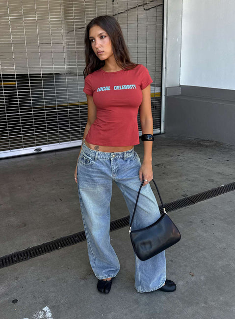 Showcasing the Ellanor Low Rise Slouch Denim Jean Washed Mid Blue Wash Tall womens-jeans front view of model wearing Princess Polly