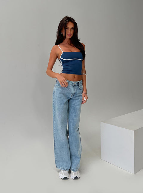 side view of model wearing Princess Polly Serenitia Mid Rise Relaxed Jeans Light Wash Tall Mid Rise 