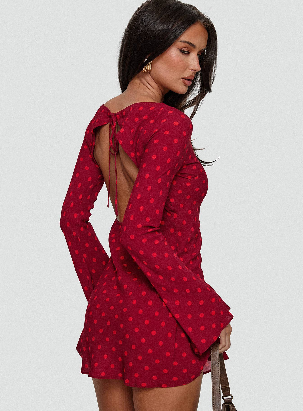 back view of model wearing Princess Polly Good Graces Long Sleeve Mini Dress Red Dot Boat Neck 