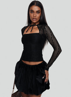 back view of model wearing Princess Polly Georgiana Bubble Hem Mini Skirt Black Mini Skirts Skirts 