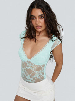 side view of model wearing Princess Polly Tantalize Bodysuit Blue Short Sleeve Bodysuit 