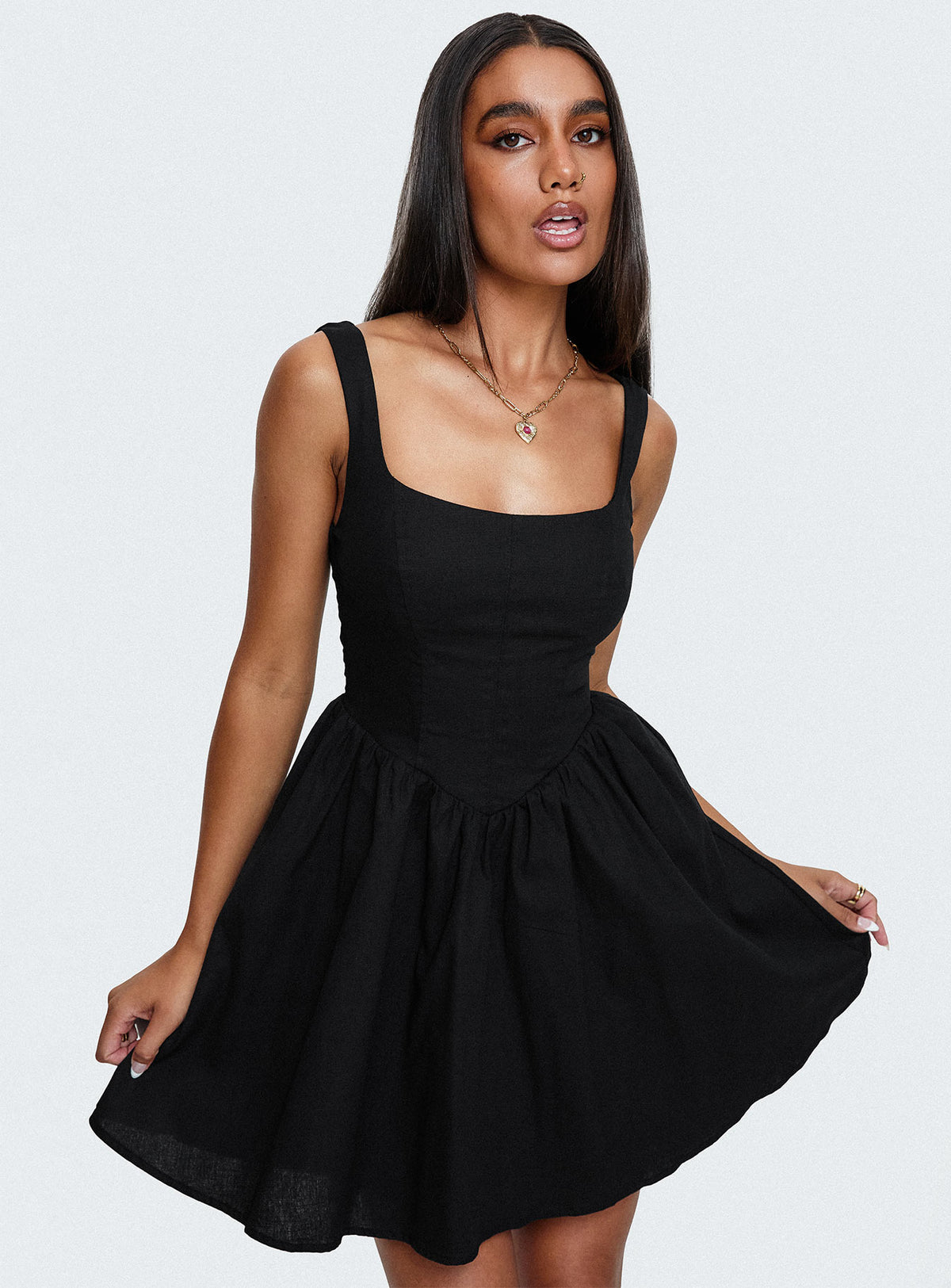 side view of model wearing Princess Polly Martie Mini Dress Black Square Neck 