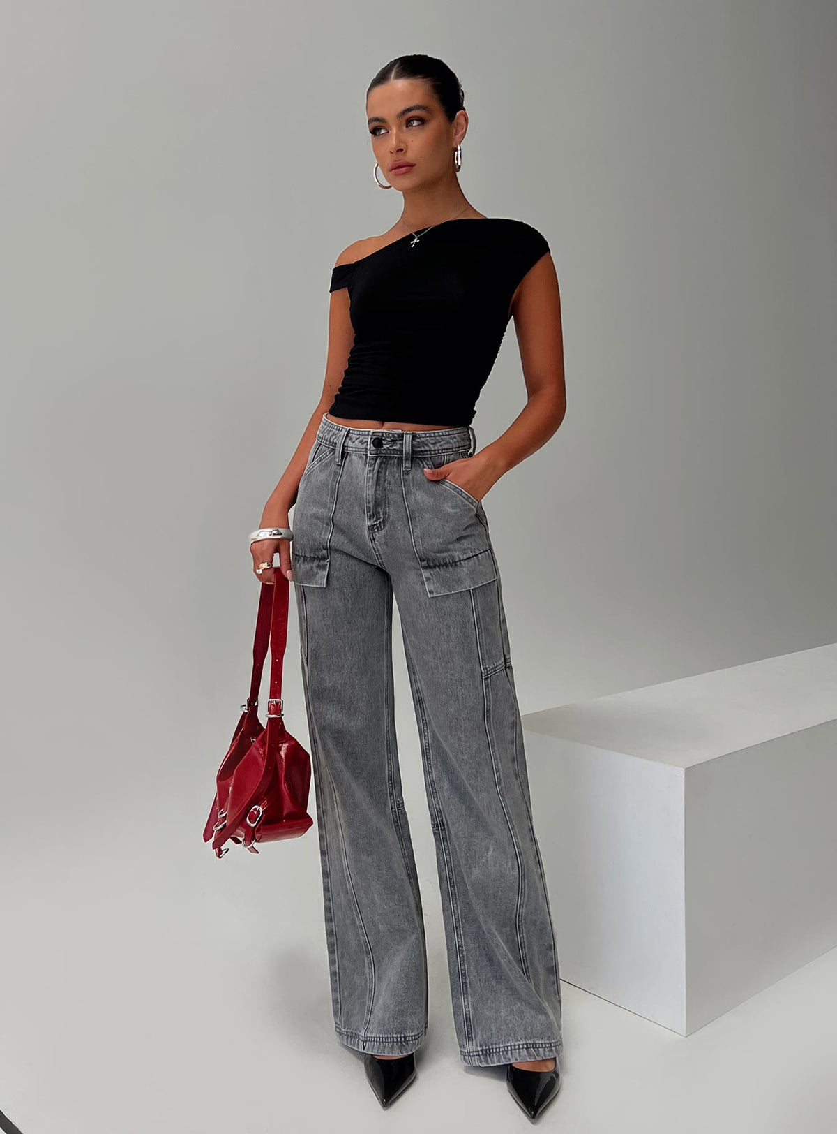 front view of model wearing Princess Polly Chad High Rise Flared Cargo Jeans Washed Grey Mid Rise Jeans Jeans 