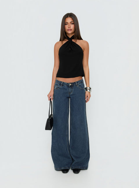 Showcasing the Picco Ultra Low Rise Wide Leg Jeans Dark Blue Wash Petite in womens-jeans with low-rise waist front view of model wearing Princess Polly