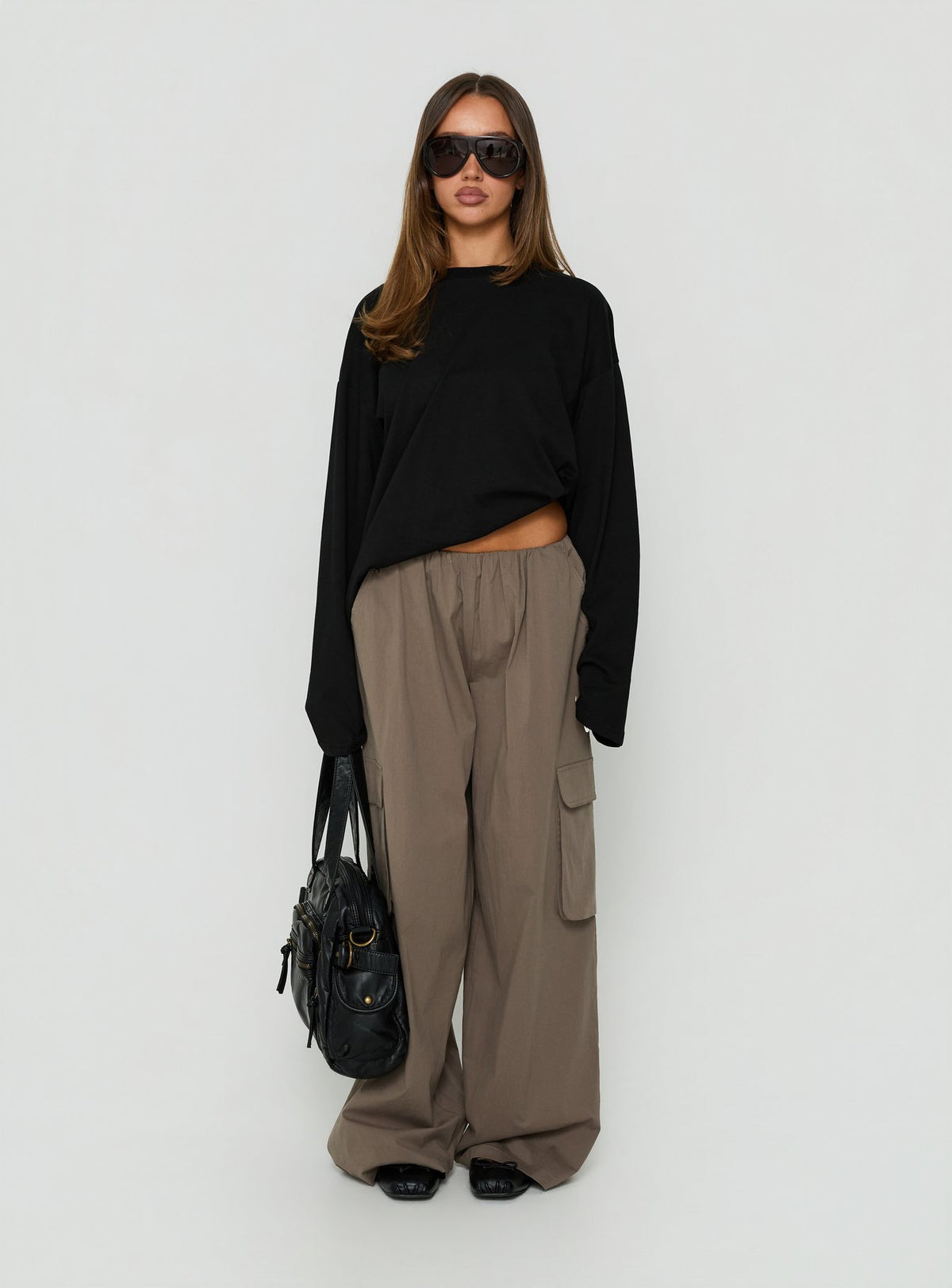Featuring Lunea Concealed Waistband Cargo Pants Charcoal womens-regular-pants with mid-rise detail view of model wearing Princess Polly