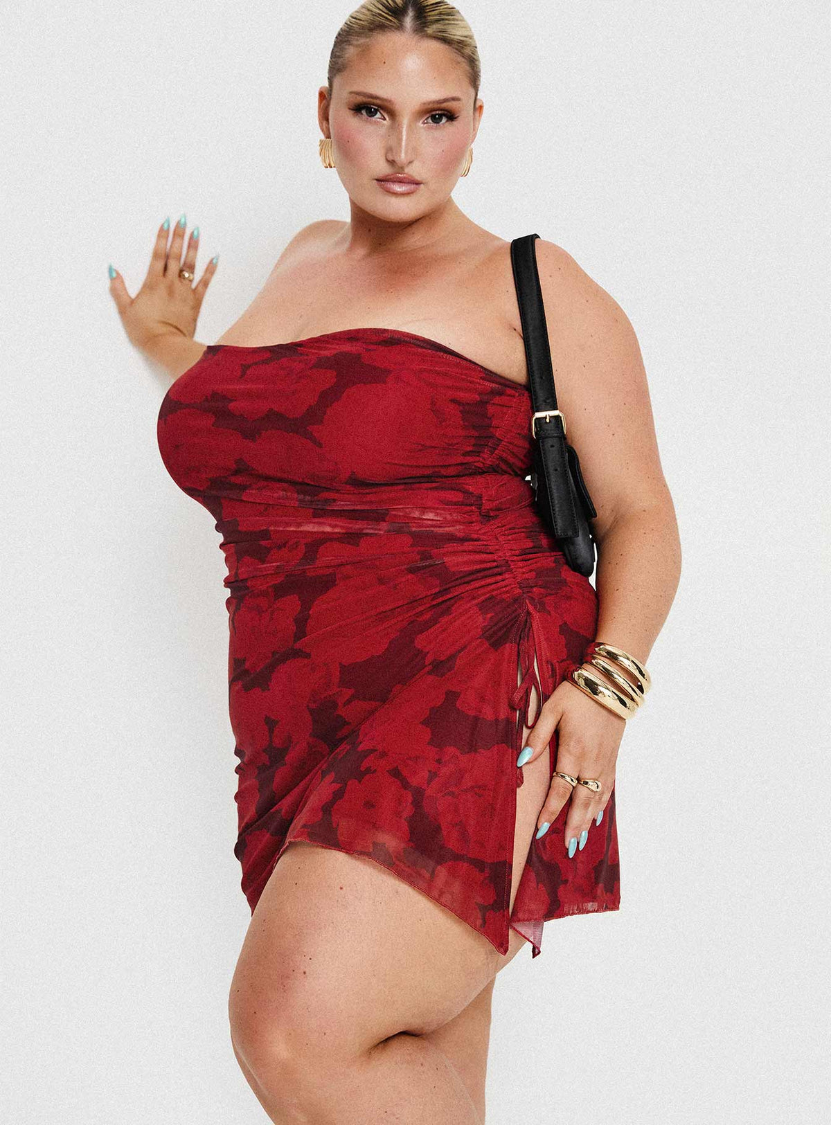 side view of model wearing Princess Polly Donelli Mini Dress Burgundy / Red Floral Curve Straight Neck 