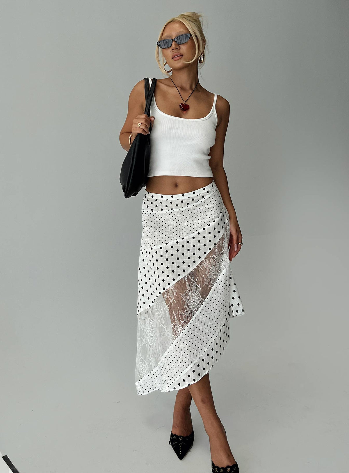   side view of model wearing Princess Polly Rennar Maxi Skirt White / Polka Dot Petite Midi Skirts Skirts 