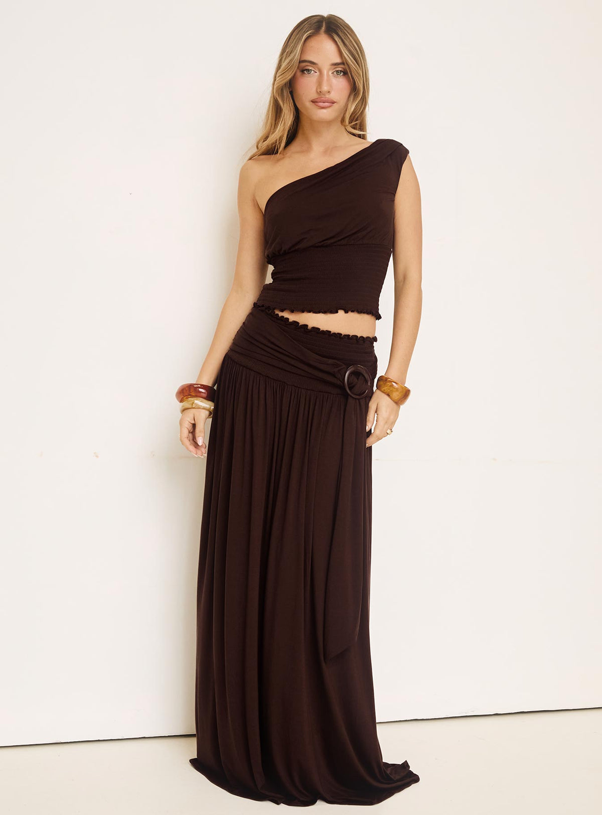   front view of model wearing Princess Polly Full Orbit Shirred Maxi Skirt Chocolate Brown Maxi Skirts Skirts 
