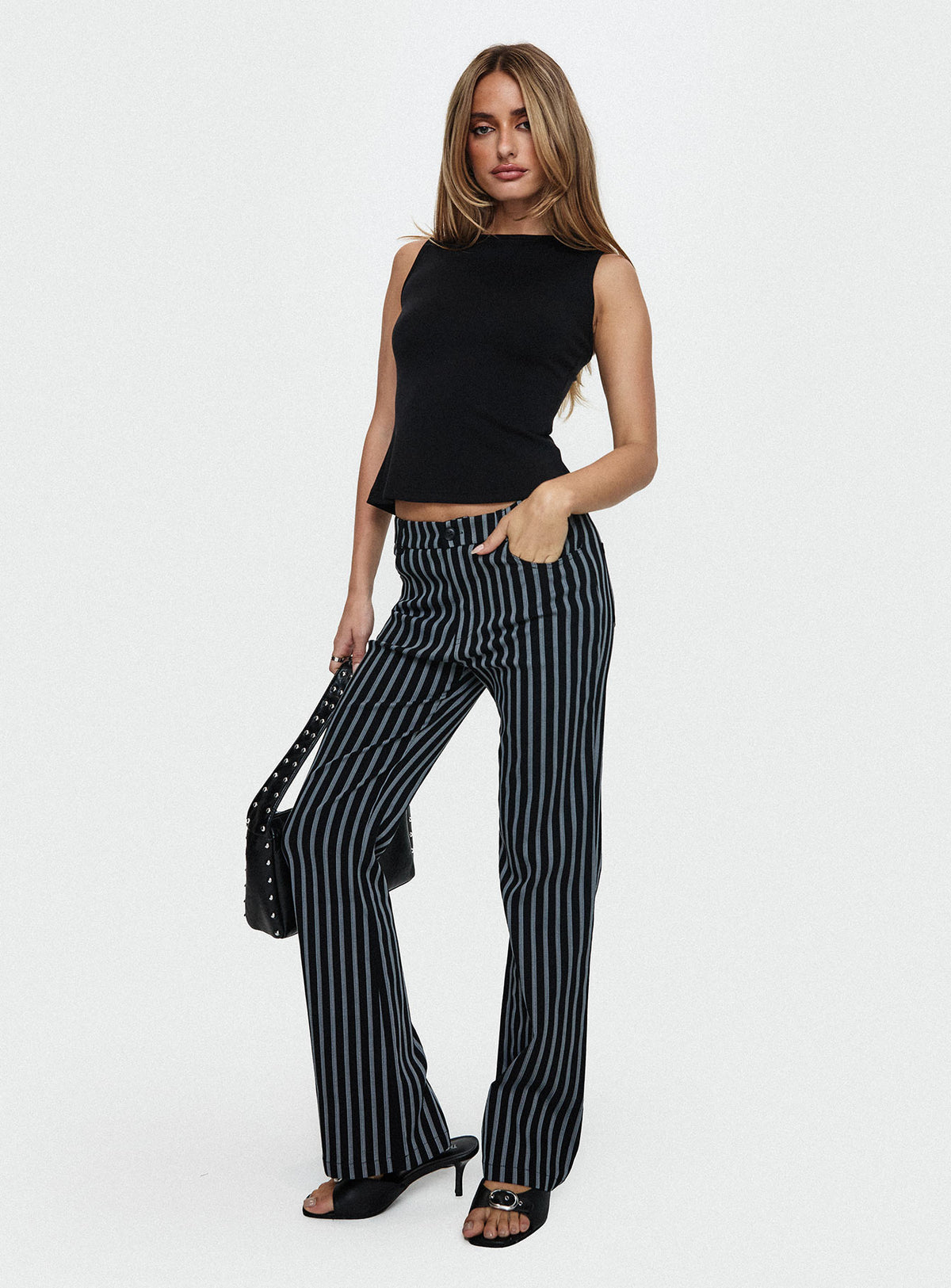 front view of model wearing Princess Polly Allude Low Waist Pinstripe Pant Black Low Rise Pants Pants 