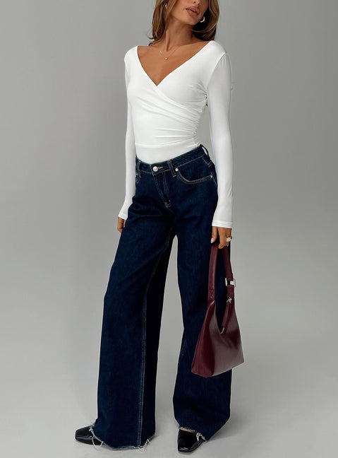 front view of model wearing Princess Polly Right Here Cross Detail Bodysuit White Long Sleeve Tops Bodysuit 