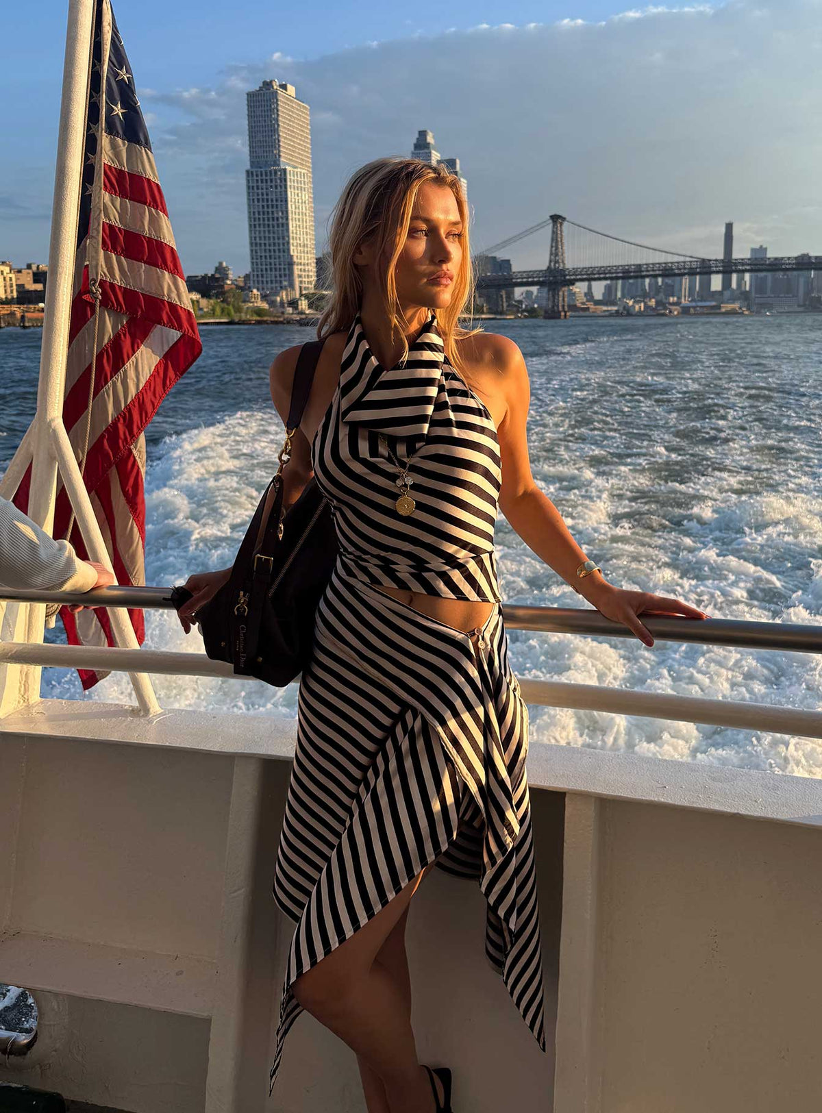   side view of model wearing Princess Polly Allure Midi Skirt Noir Stripe Midi Skirts Skirts 