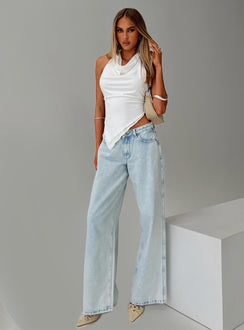 back view of model wearing Princess Polly Brayden Low Rise Relaxed Jeans Light Acid Wash Low Rise Jeans Jeans 