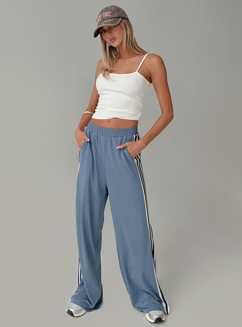 side view of model wearing Princess Polly Dime Track Pants Blue High Rise Pants Pants 