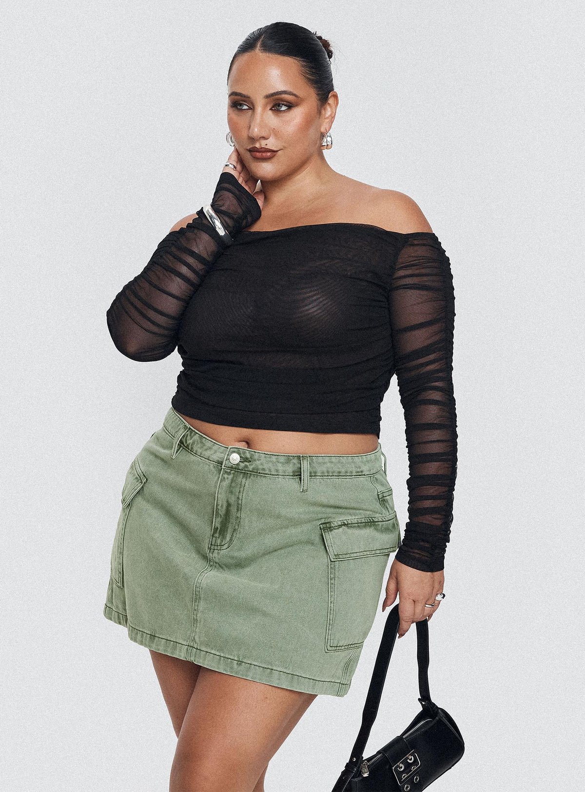 side view of model wearing Princess Polly Hartford Off The Shoulder Top Black Curve Full Sleeves straight 
