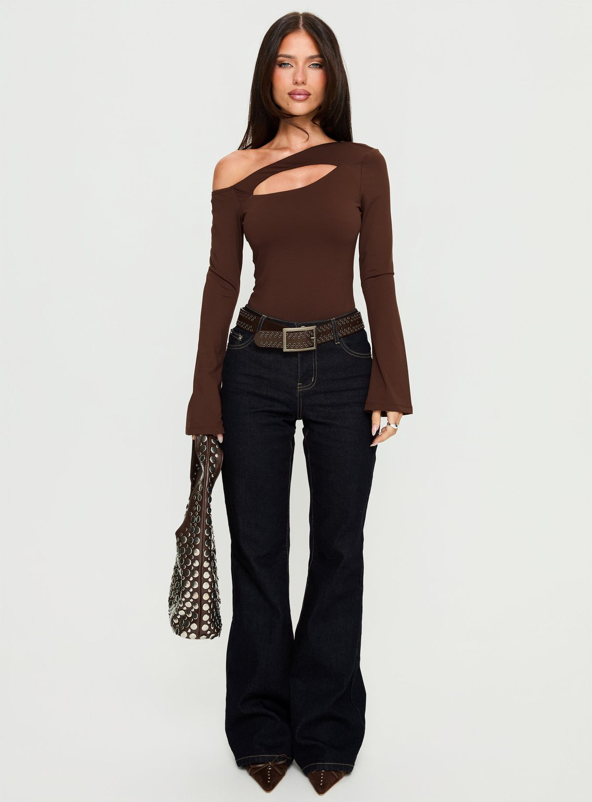 front view of model wearing Princess Polly Raissa Cut Out One Shoulder Bodysuit Brown Long Sleeve Tops Bodysuit 