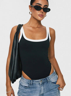 front view of model wearing Princess Polly Astrea Bodysuit Black / White Sleeveless Bodysuit 