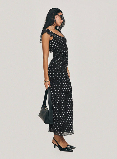 side view of model wearing Princess Polly Sandberg Maxi Dress Black Polka Dot Scoop Neck 