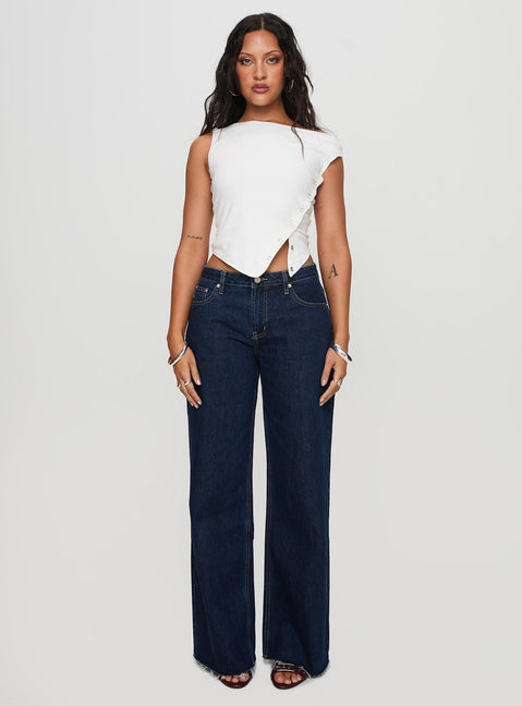 side view of model wearing Princess Polly Darla Low Rise Straight Jean Dark Wash Petite Low Rise Jeans 