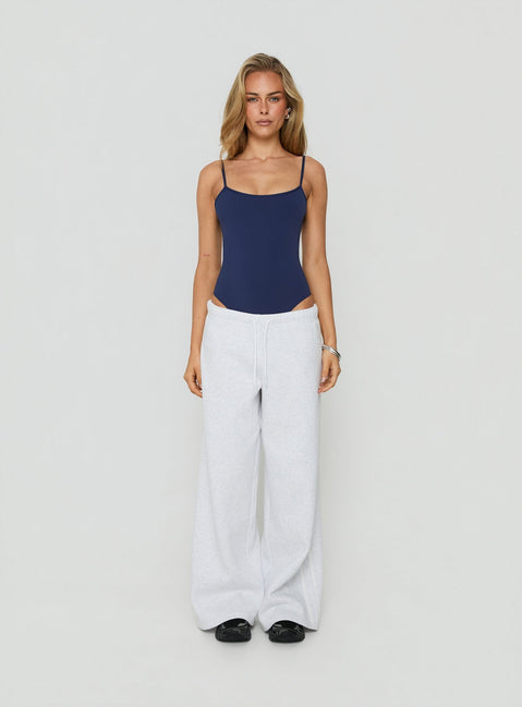 Designed with sleeveless construction, the Daily Define Thin Strap Low Back Bodysuit Navy womens-bodysuit back view of model wearing Princess Polly