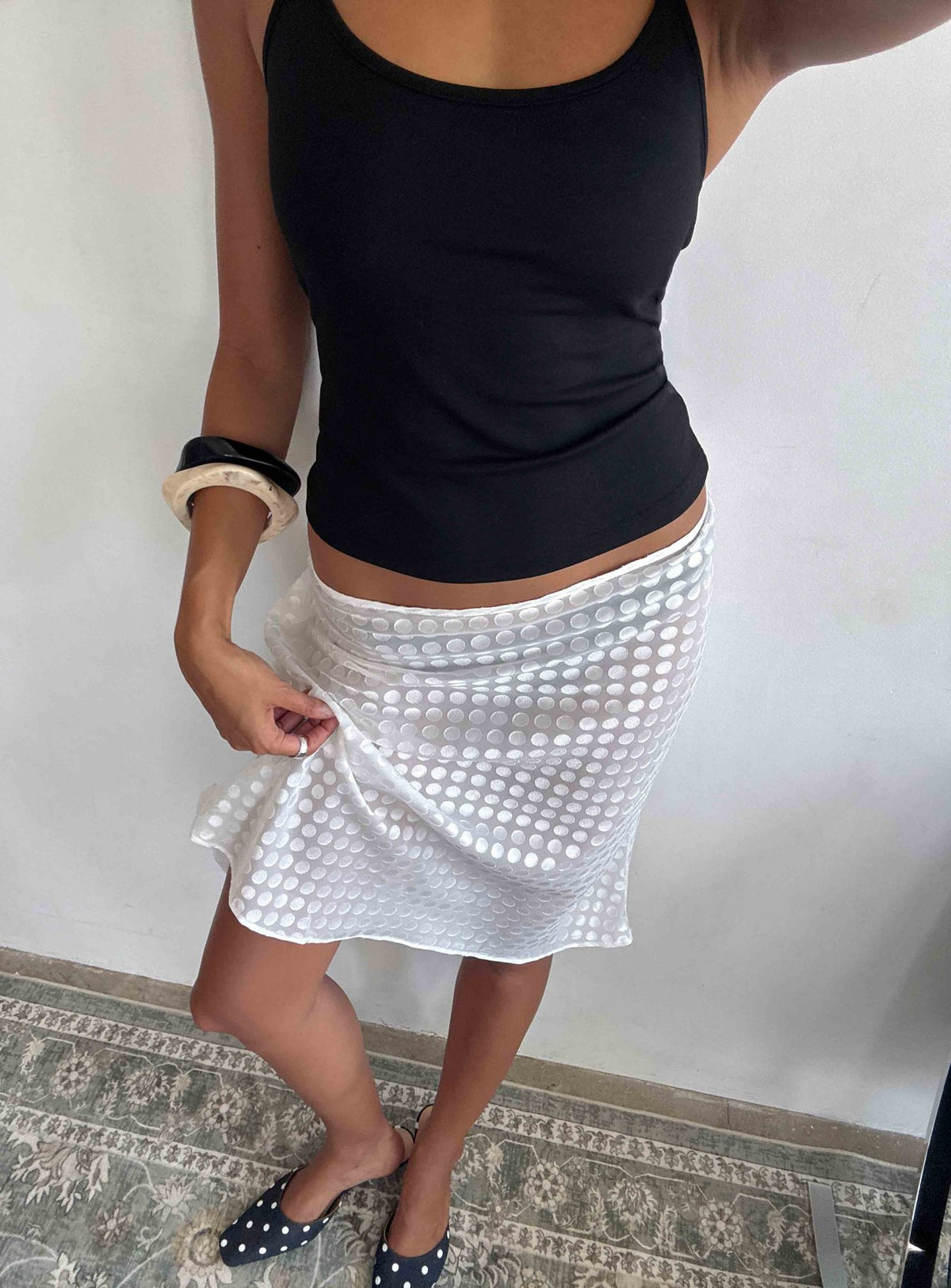 Perfectly styled, the Evangela Sheer Midi Skirt White Polka Dot womens-skirts featuring midi length detail front view of model wearing Princess Polly