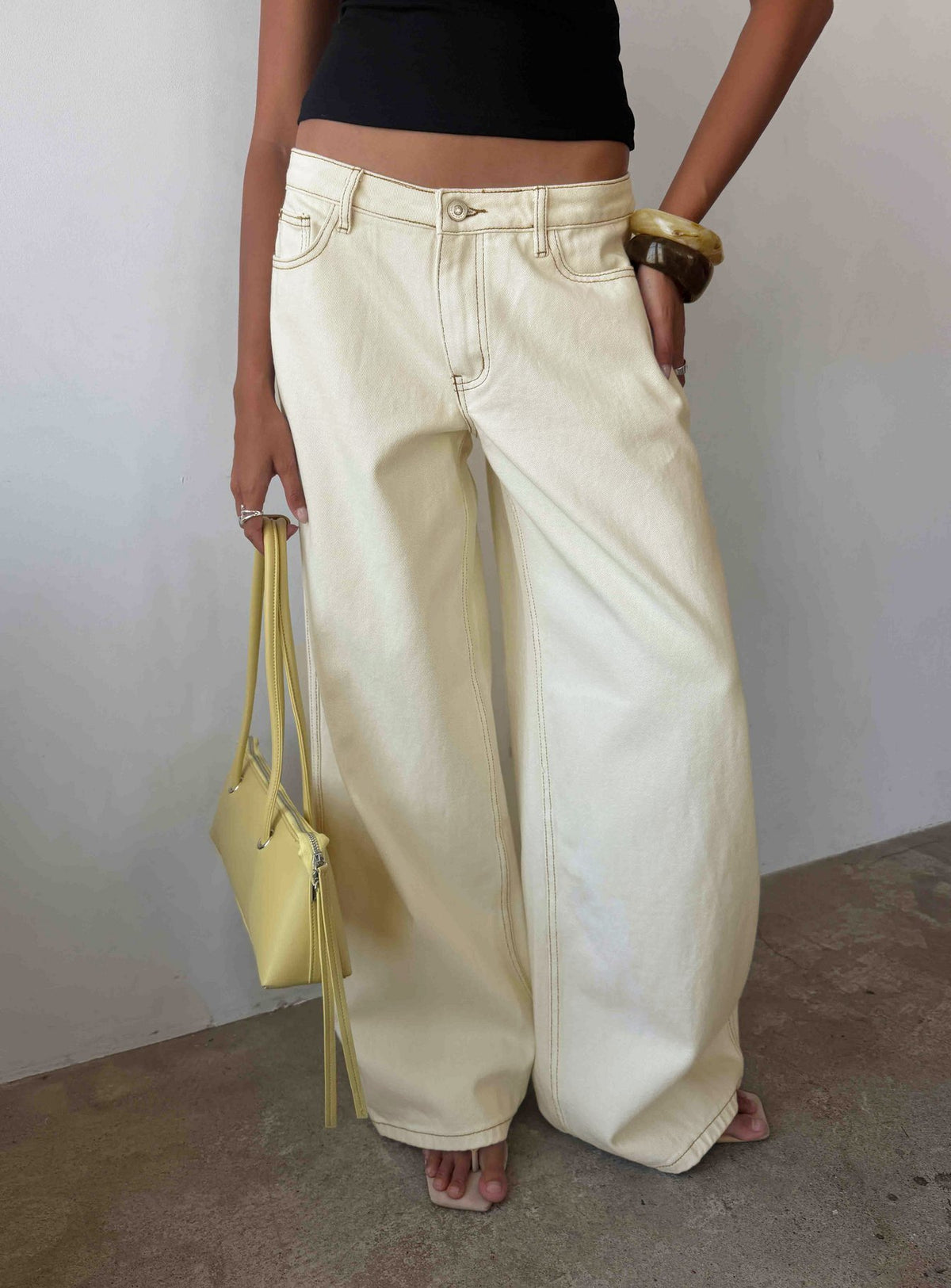 Showcasing Ramos Low Rise Wide Leg Jeans in Cream womens-jeans with low-rise waist detail