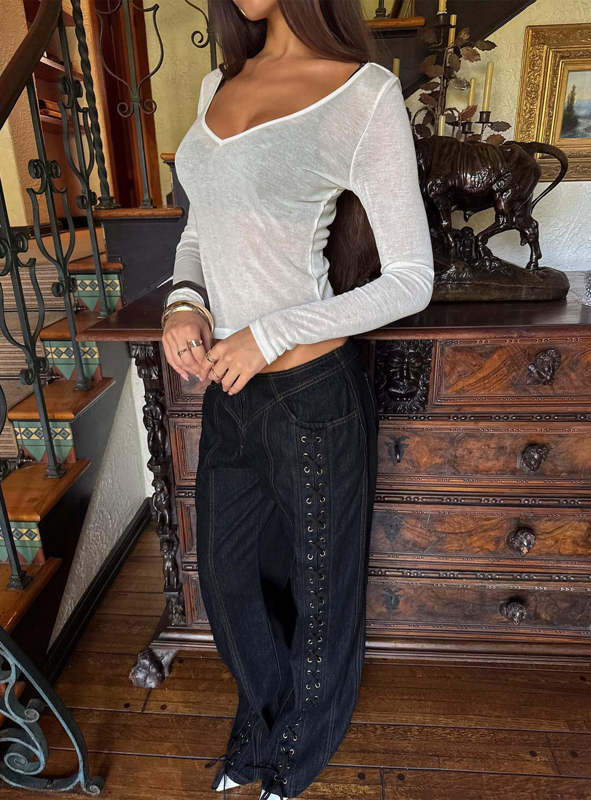 Showcasing the Daydream Tie Up Jeans in Dark Denim womens-jeans with low-rise front view of model wearing Princess Polly