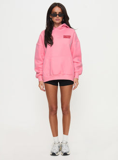 side view of model wearing Princess Polly Princess Polly Hooded Sweatshirt Bubble Text Pink / Red Longline Jumpers Jumpers 