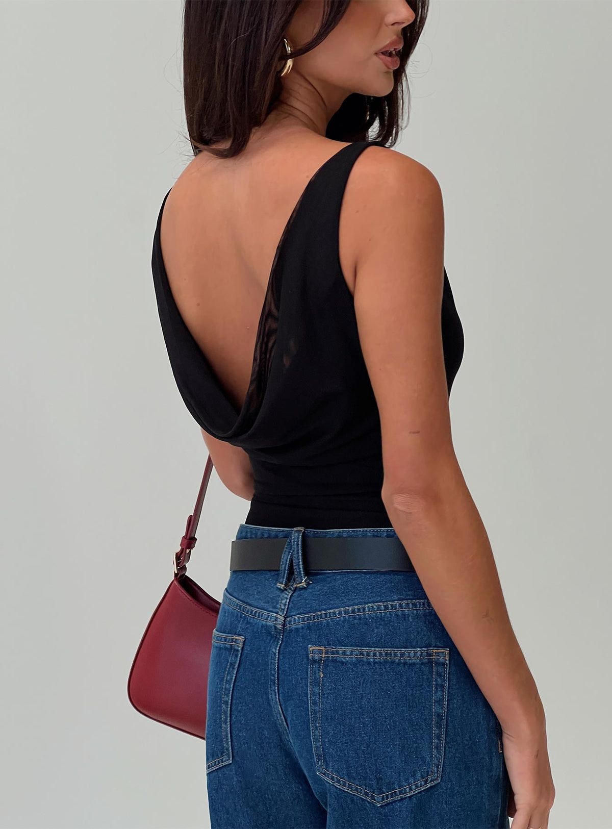back view of model wearing Princess Polly Axton Cowl Neck Bodysuit Black Sleeveless Bodysuit 