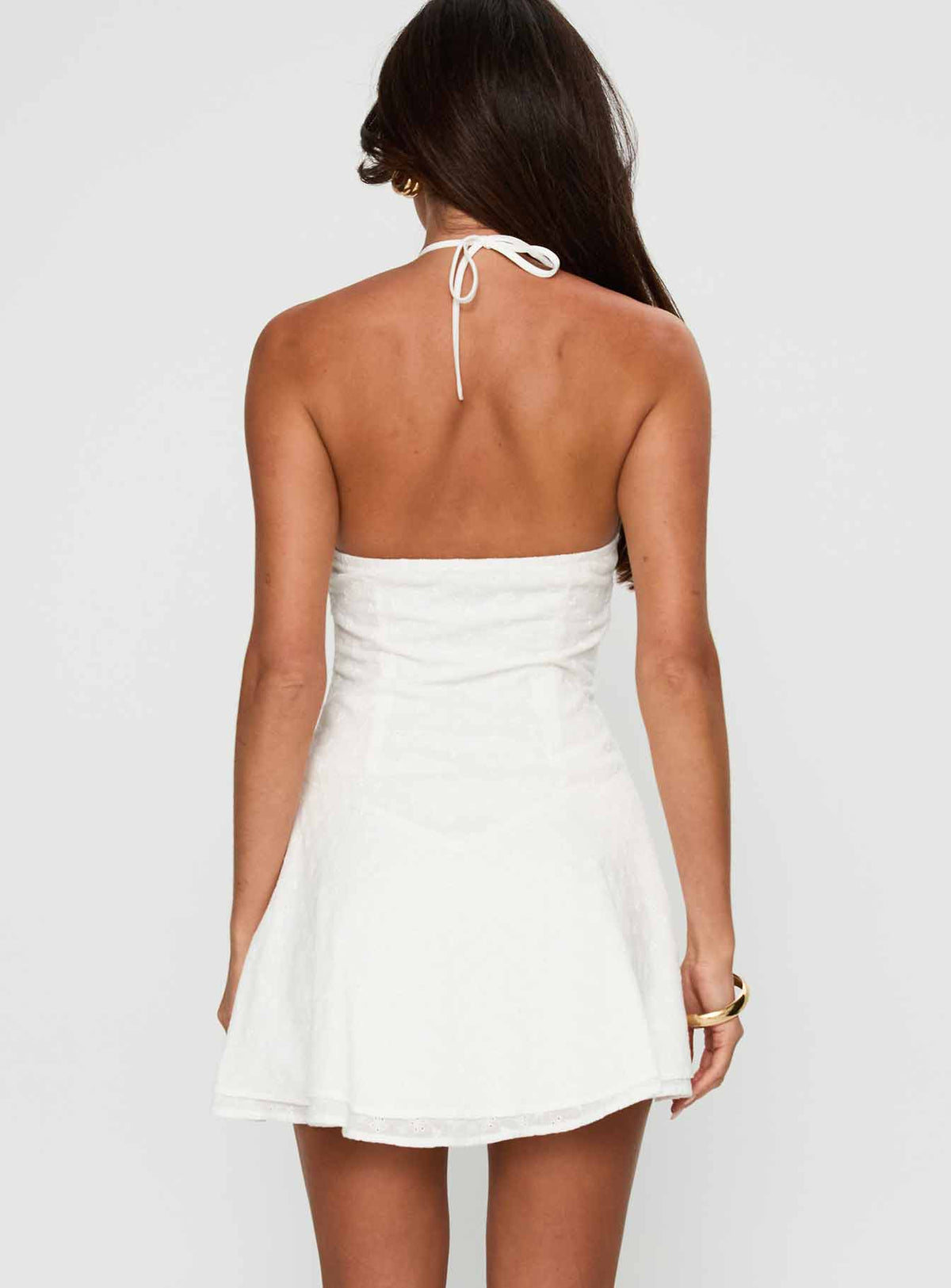 back view of model wearing Princess Polly Flowerchild Halter Mini Dress White Asymmetric Neckline 