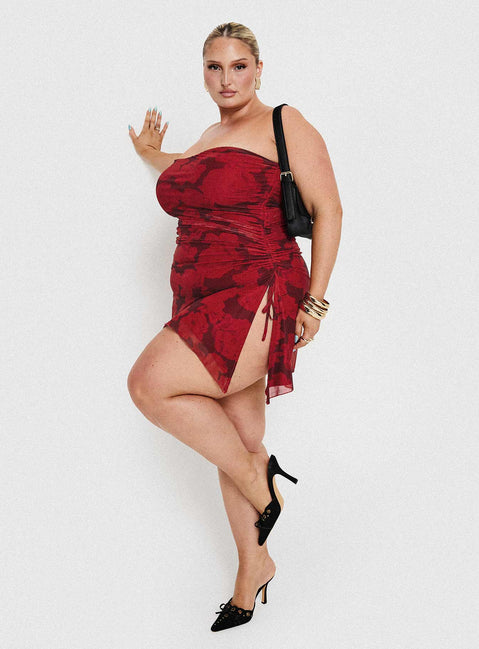 side view of model wearing Princess Polly Donelli Mini Dress Burgundy / Red Floral Curve Straight Neck 