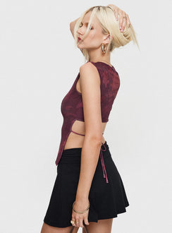 back view of model wearing Princess Polly Uzo Top Red Floral Sleeveless Crew Neck 