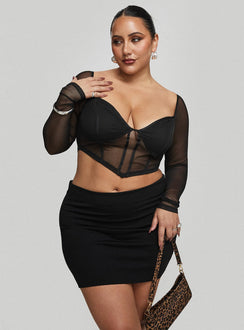   side view of model wearing Princess Polly Karley Low Waist Mini Skirt Black Curve Mini Skirts Skirts 
