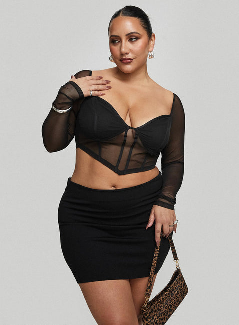   side view of model wearing Princess Polly Karley Low Waist Mini Skirt Black Curve Mini Skirts Skirts 