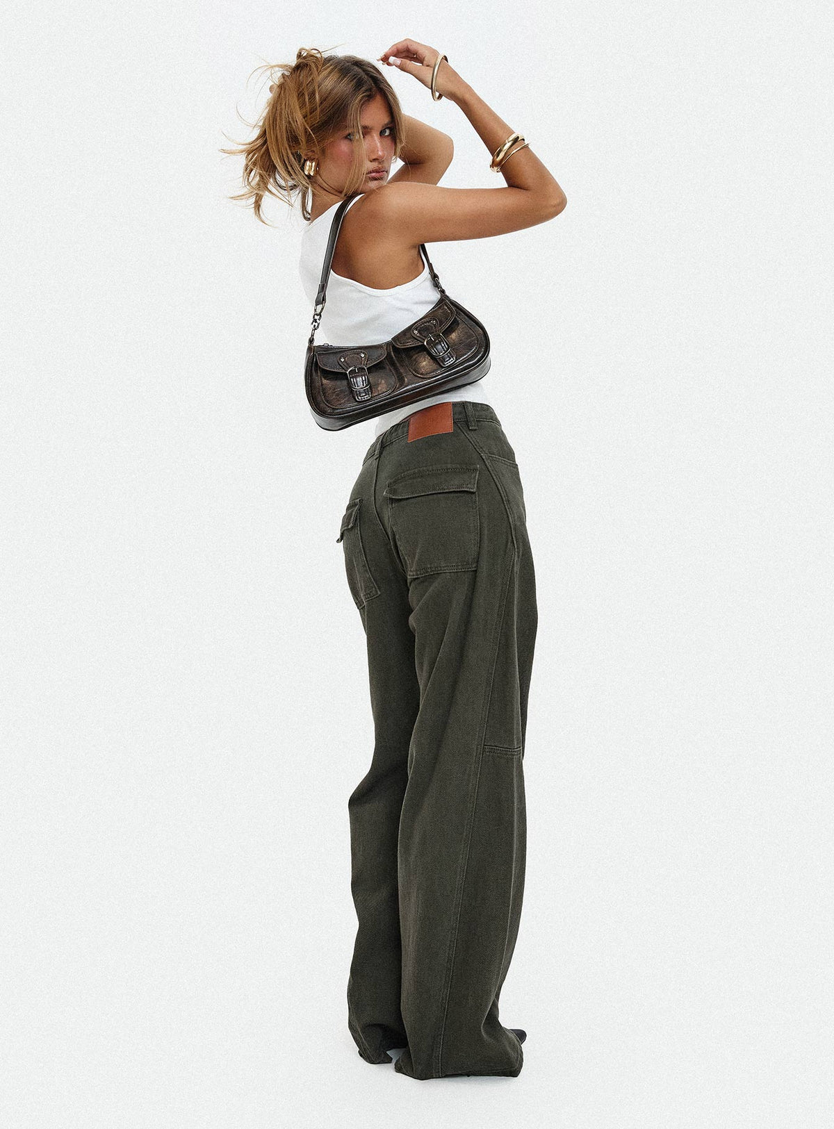 side view of model wearing Princess Polly Bruiser Tie Waist Mid Rise Wide Leg Jeans Green High Rise Jeans Jeans 
