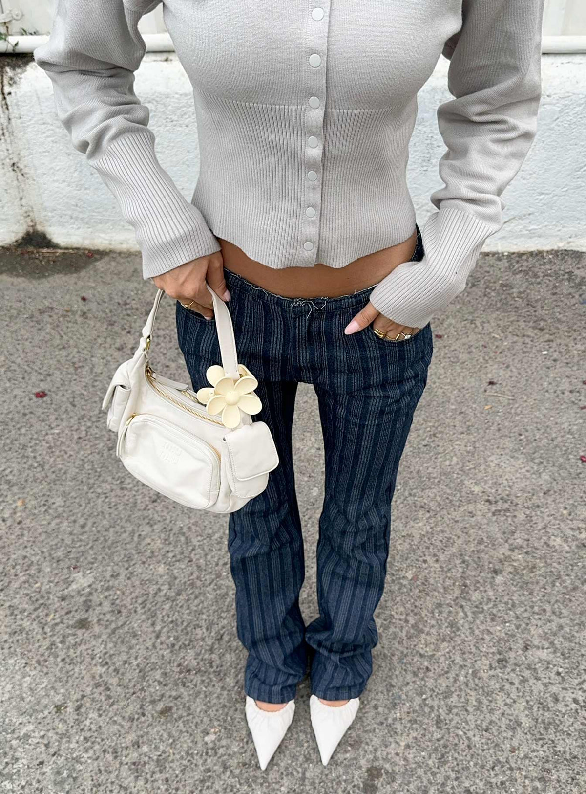 front view of model wearing Princess Polly Charismatic Low Rise Flared Jeans Dark Pinstripe Low Rise Jeans Jeans 