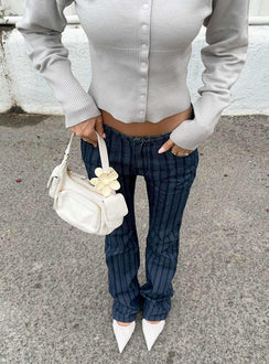 front view of model wearing Princess Polly Charismatic Low Rise Flared Jeans Dark Pinstripe Low Rise Jeans Jeans 