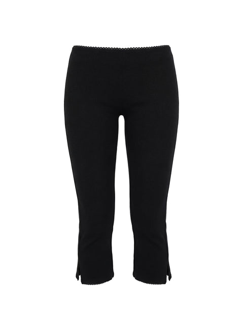 side view of model wearing Princess Polly Baseline Rib Capri Pants Black Petite Mid Rise Pants Pants 