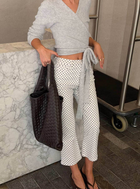 side view of model wearing Princess Polly Cindee High Rise Cropped Jeans White Polka Dot High Rise Jeans Jeans 