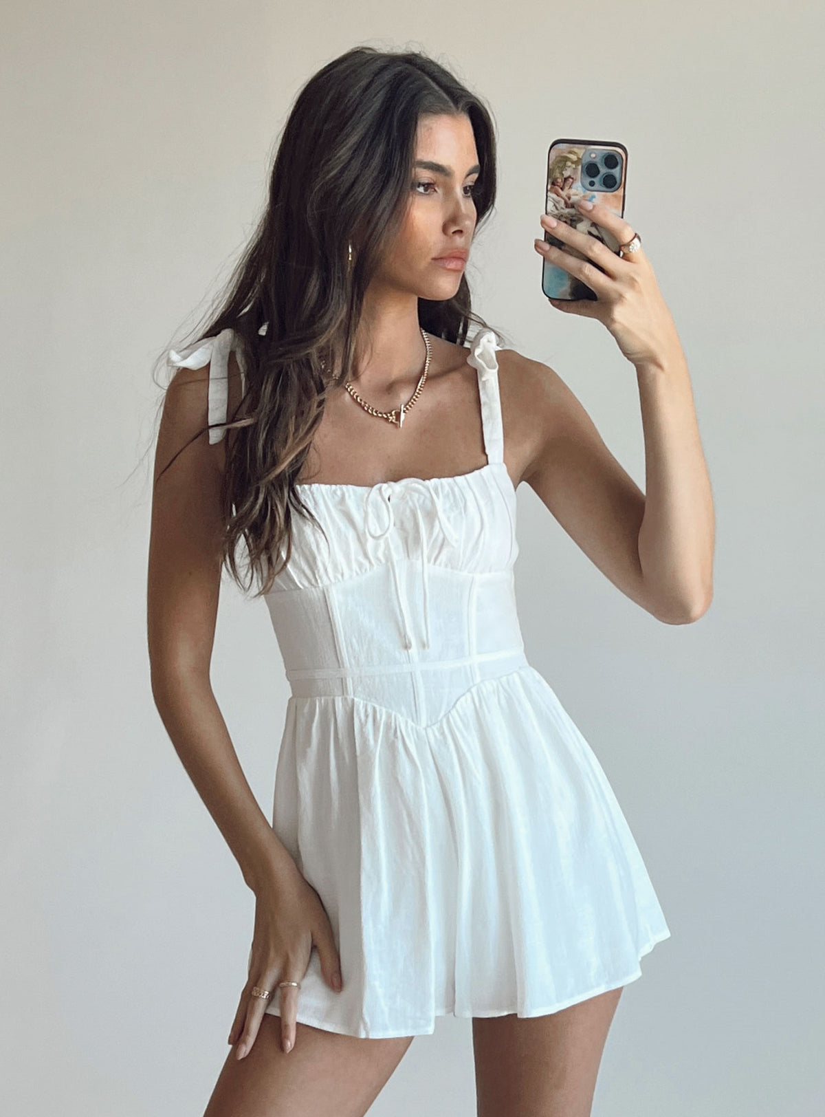 Romper Tie shoulder straps  Tie at bust  Fitted waist  Invisible zip fastening at back  Non-stretch
