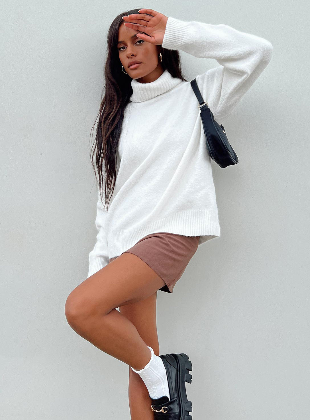 side view of model wearing Princess Polly Oswin Turtleneck Sweater White Longline Jumpers Jumpers 