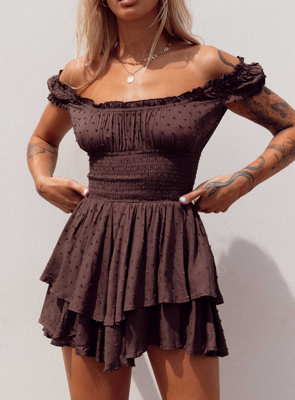 Romper Soft textured material Shirred waistband Ruffle detailing Elasticated neck and sleeves Can be worn on or off shoulder Layered ruffle hem Fully lined