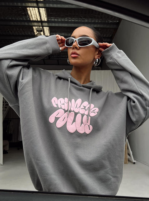 side view of model wearing Princess Polly Princess Polly Hooded Sweatshirt Bubble Text Charcoal / Light Pink Longline Jumpers Jumpers 
