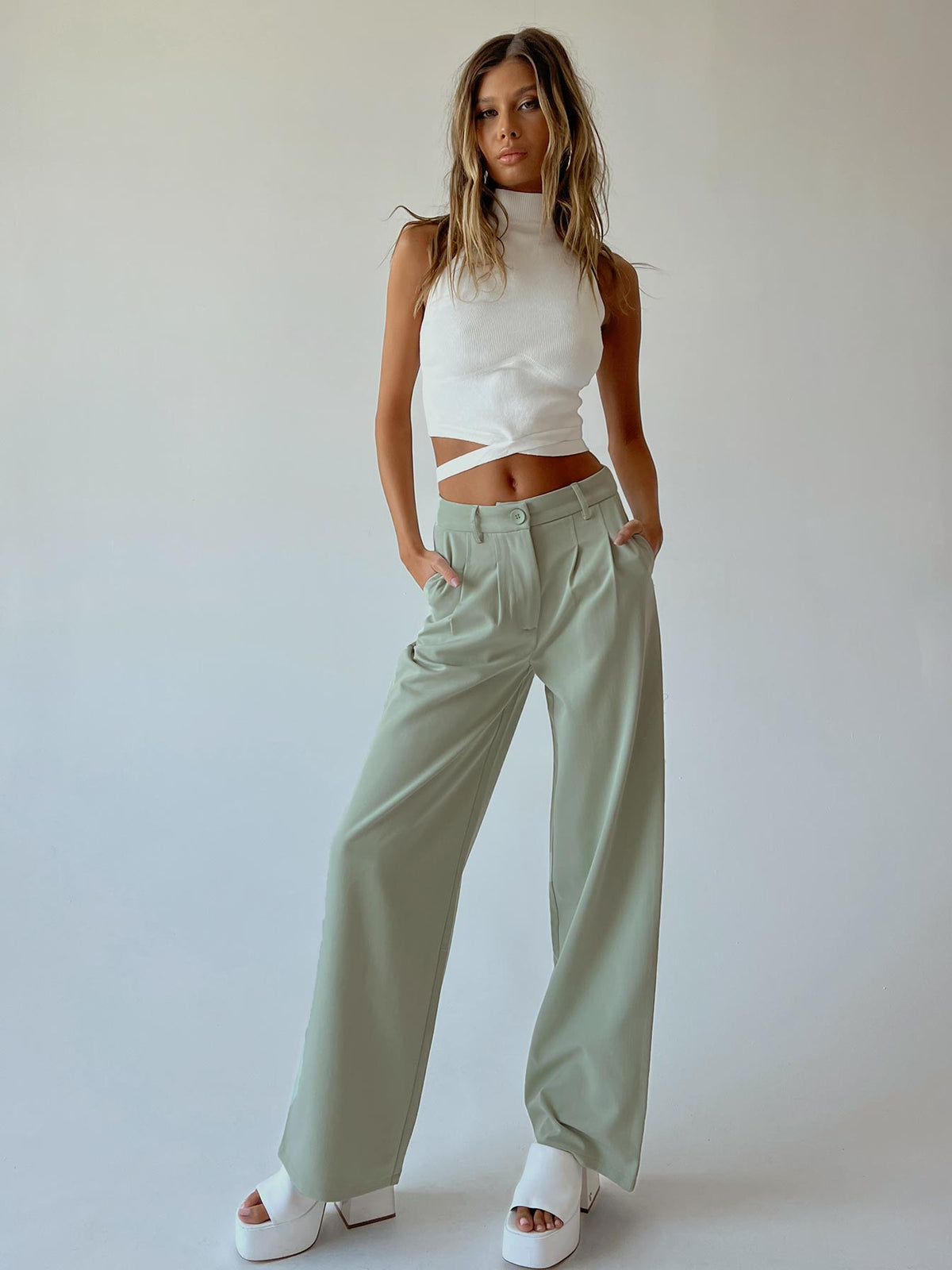 front view of model wearing Princess Polly Archer Pants Green Pants 