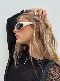Sunglasses Wrap around design Light weight frame Brown tinted lenses Moulded nose bridge