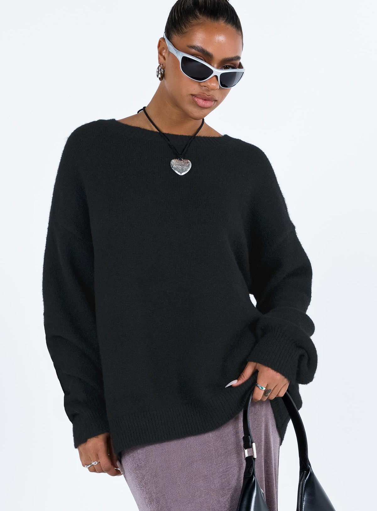 Featuring the Ryanna Sweater Black womens-jumpers in long length with oversized fit and round neckline side view of model wearing Princess Polly