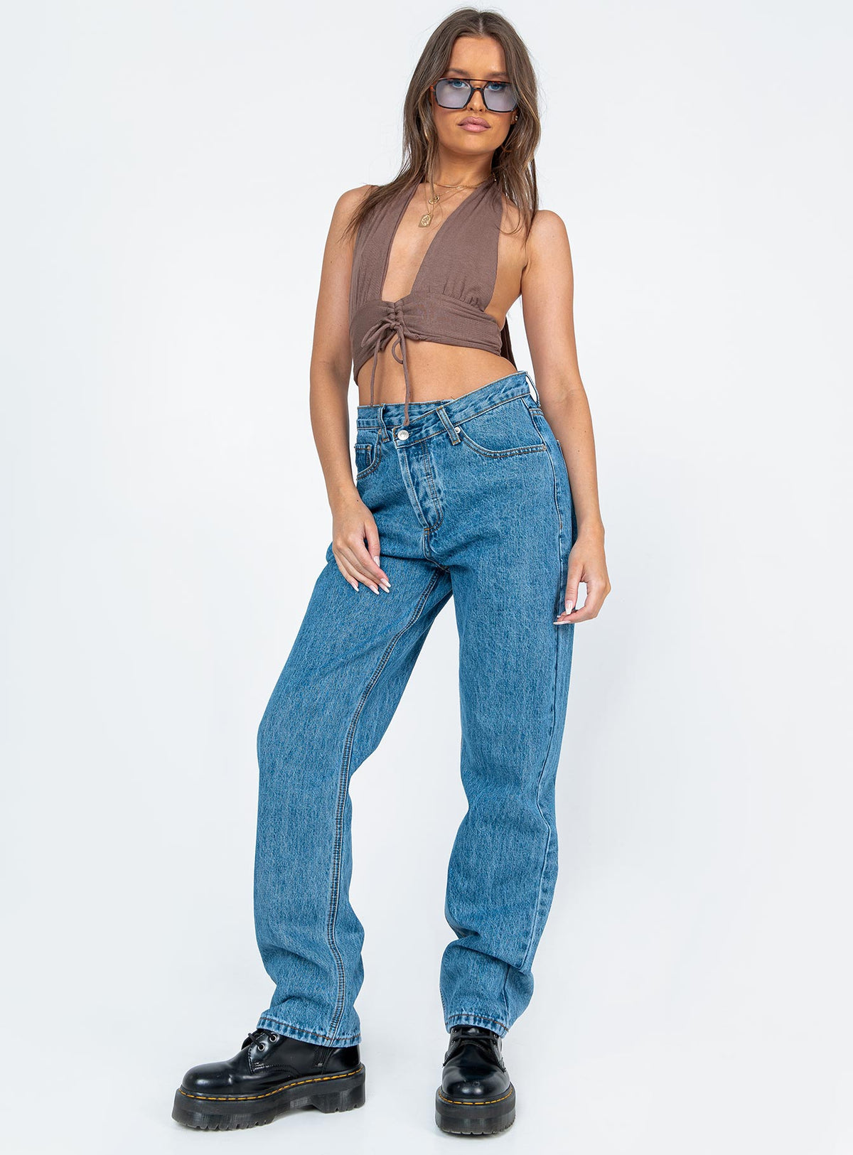 front view of model wearing Princess Polly Holly Asymmetric Straight Leg Jean Mid Wash Denim Mid Rise Jeans Jeans 