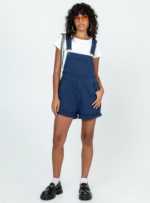 Overalls Denim material Adjustable buckle straps Button fastening at sides Large chest pocket Classic four pockets  Gold-toned hardware  Fixed rolled hem