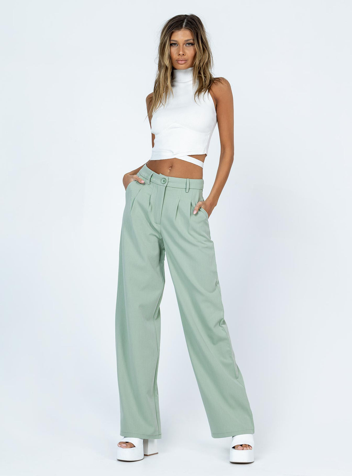 side view of model wearing Princess Polly Archer Pants Green Pants 
