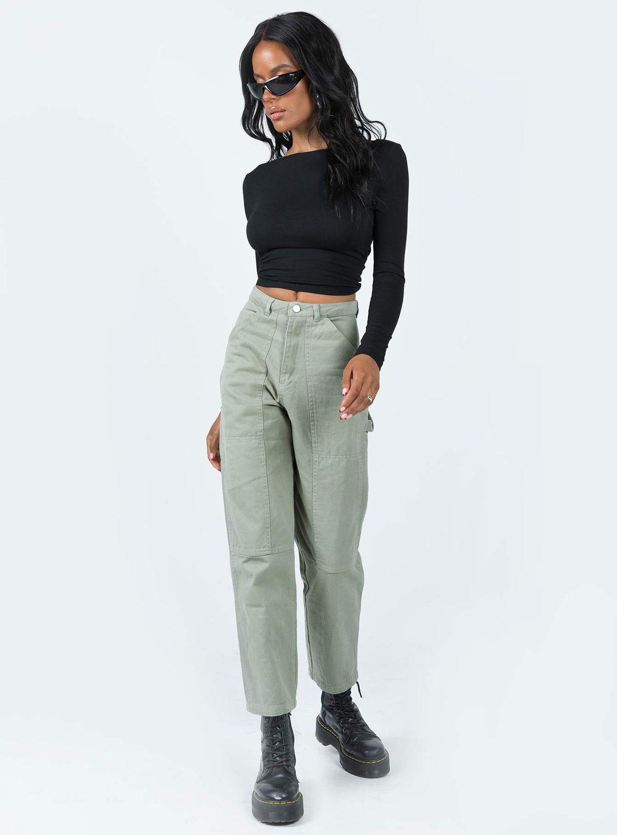 Front view of model wearing  front Princess Polly High Waisted Pants  Dropouts Cargo Pants Green