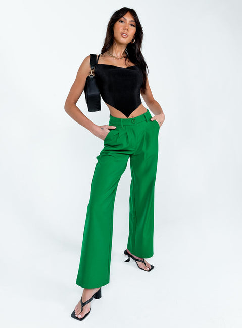side view of model wearing Princess Polly Archer Pants Apple Green Pants 